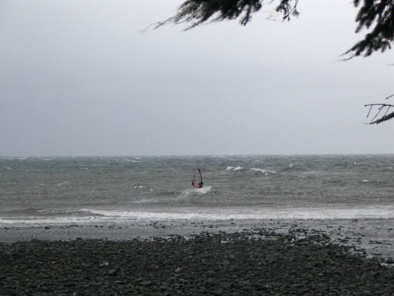 Gonna Give It a Go, Dood
Mark with flat 3-8 'jumpstarted' during a 'lull' fully sheeted out, only to be absolutely flattened by a hail squall 30 seconds later - good on ya dood, yahoo!! Mill Bay,  45-55 knots, March 8 2006; wish I had a picture of the hail that turned out :(
