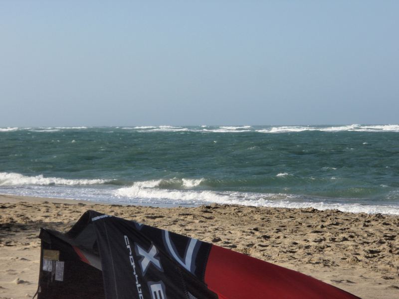 Waves and strong winds
Warm water,strong winds and if you zoom in on this shot you will see mouth watering surfable waves.I was doing vertical drops on some of these today.
